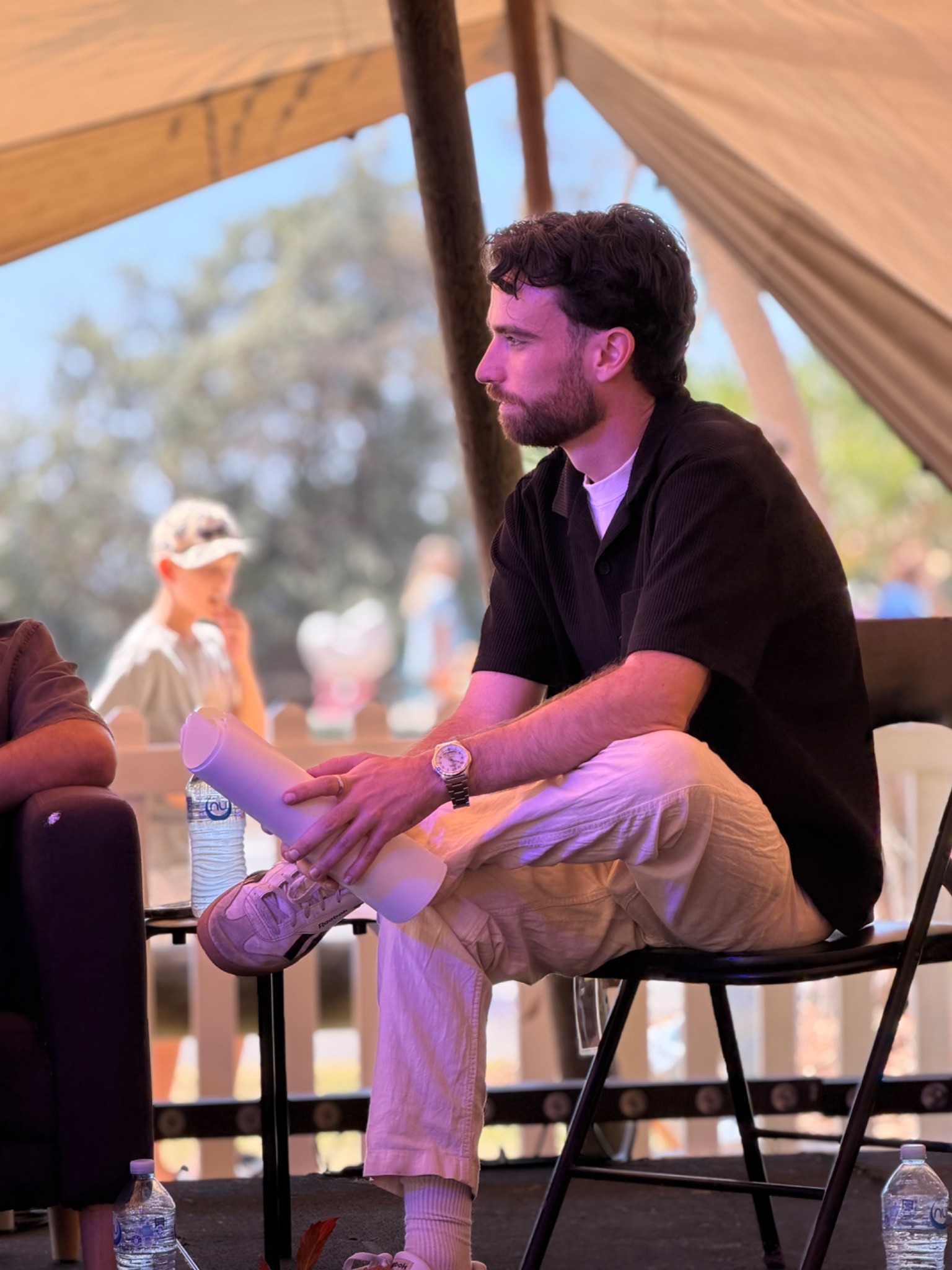 The panel host seated with notes during the SWELL conversation